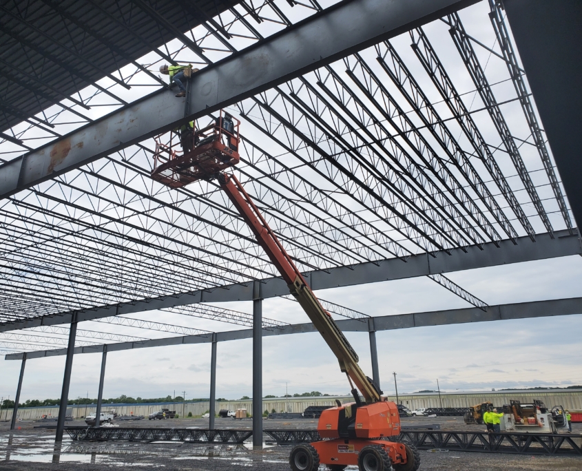 Worker in lift working on roof